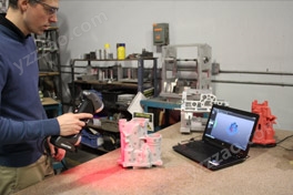 Real-time 3D scanning of the part with a Creaform 3D laser scanner